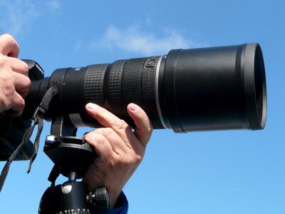 Camera tripod recording photographer