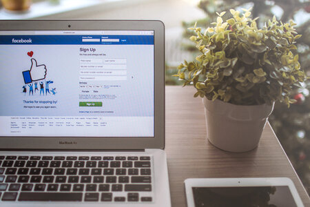 Laptop with a login page on facebook in the home office photo