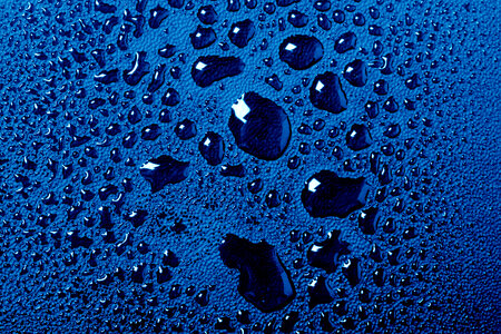 Blue water drops macro background