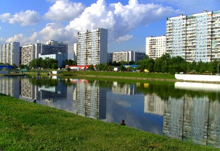 Moscow urban cityscape with buildings and pond