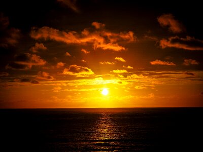 Setting sun sun and sea afterglow photo