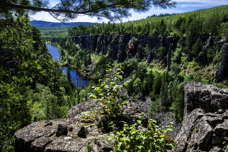 Guy Ziplining down Eagle Canyon, Ontario, Canada