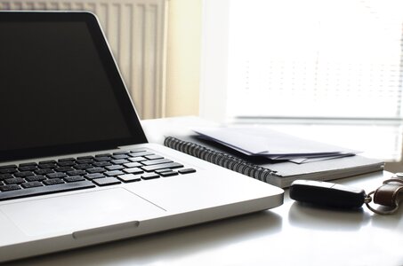 Laptop Keys Notepad Office Desk photo