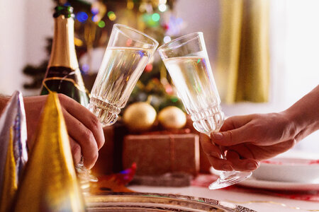 Female and male hands toasting with glasses of champagne photo