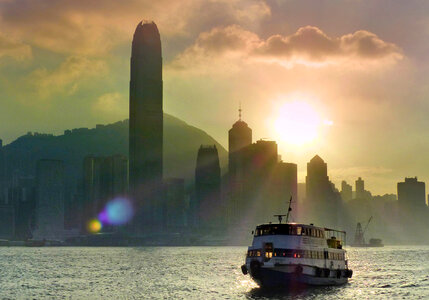 Sun setting behind skyscrapers in Hong Kong