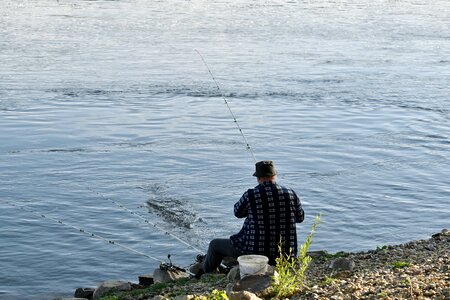 Coastline fisherman fishing photo