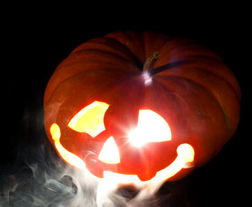 Scary pumpkin and smoke photo