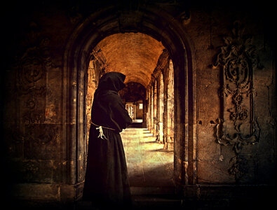 Monk standing in the doorway of a Monastery photo