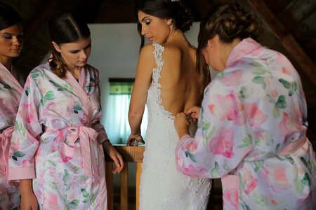 Bride wedding dress preparation photo