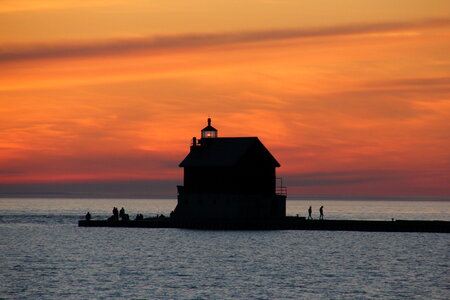 Lighthouse Seen from a Beach at Sunset