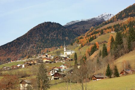 Alpine village at the foot of the mountain photo