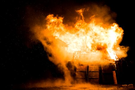 Wooden shed in flames photo