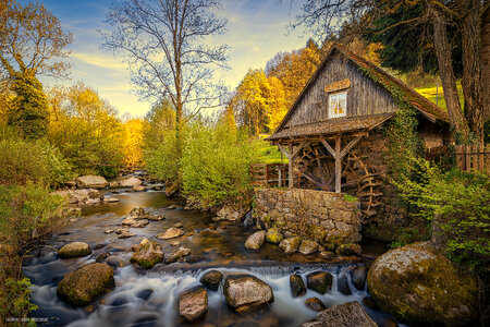Scenic Millhouse with rushing water photo