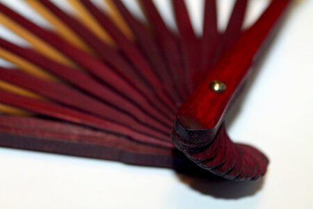 A wooden fan handle photo