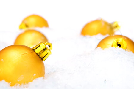 Golden Christmas Baubles in Snow photo