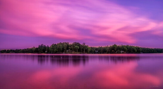 Purple skies and landscape over the lake photo