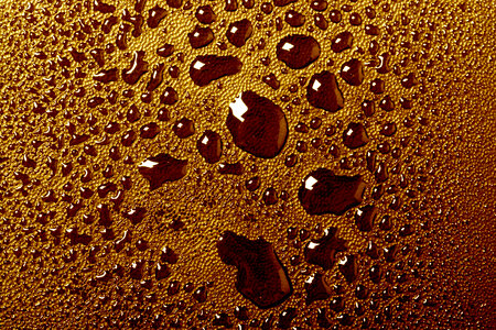 Orange water drops macro background