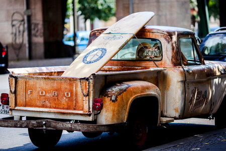 Rusty Pickup with a Surf Board photo