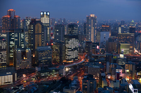 Osaka cityscape at night with skyscrapers