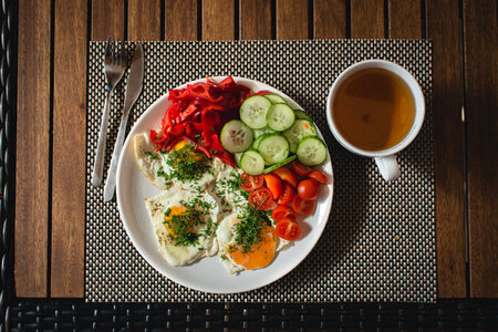 Paleo breakfast eggs with vegetables outside photo