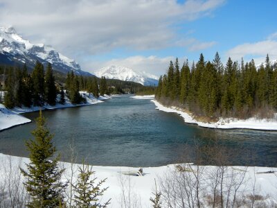 view of a calm lake & Canmore, Alberta, Canada photo