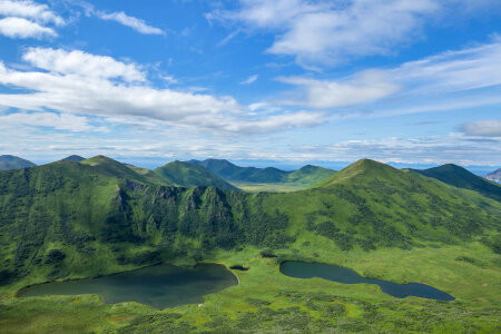 Wet tundra with numerous potholes and rolling mountains