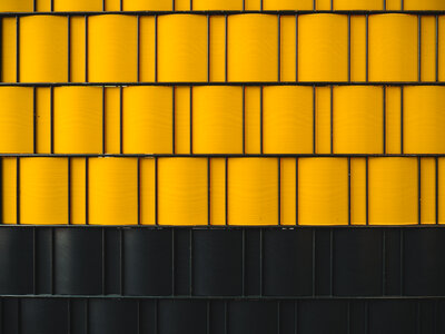 Metal Fence with Yellow and Black Elements photo