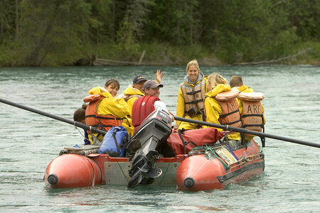 Group of people floating in a pontoon boat photo