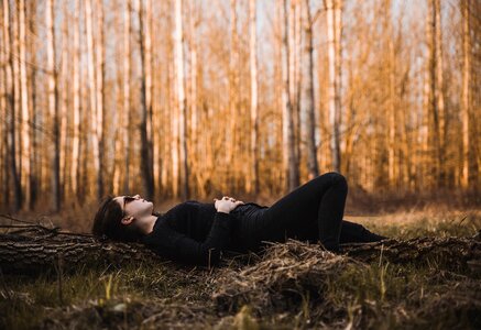 Woman Lying Down Forest photo