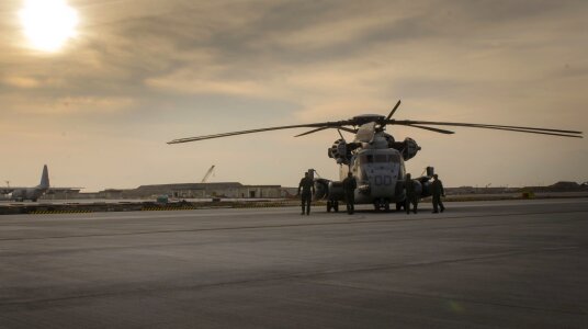 Marines inspect a CH-53E helicopter photo
