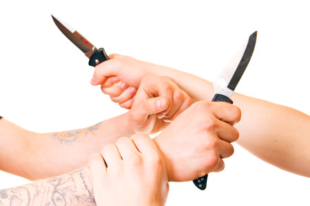 Hands with knives photo