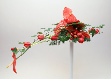 Ikebana with red spanix and tulip flowers photo