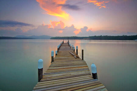 Landscape and seascape of dock into the water photo