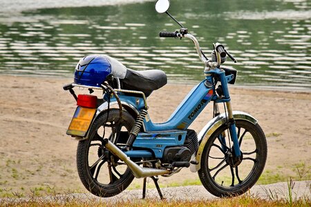 Moped riverbank summer time