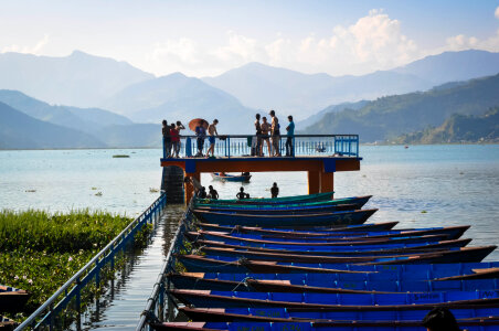 Boats docked along Fewa Lake, Pokhara, Nepal. photo