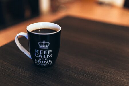 Black & White Coffee Mug on Desk photo