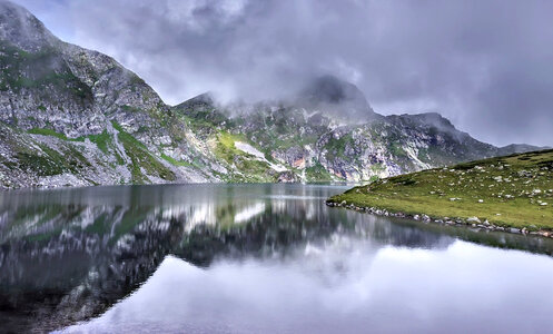 Fog and Clouds with lake and reflections photo