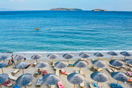 Beach Scene with Beautiful Turquoise Sea and Umbrellas photo
