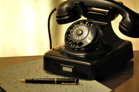 Detail monochrome view of old vintage dial telephone photo