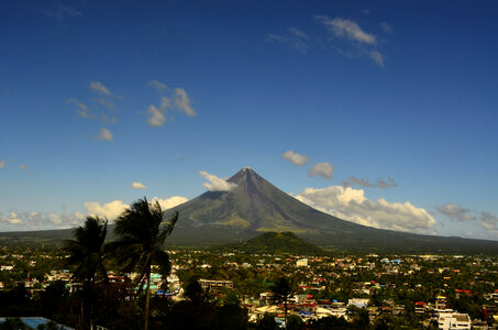 Mountain rising above the landscape of the town in the Philippines photo