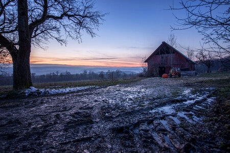 Winter landscape with small house photo