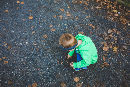 A Little Boy Playing Outside photo