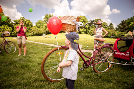 Little Boy with Red Balloon in Park photo