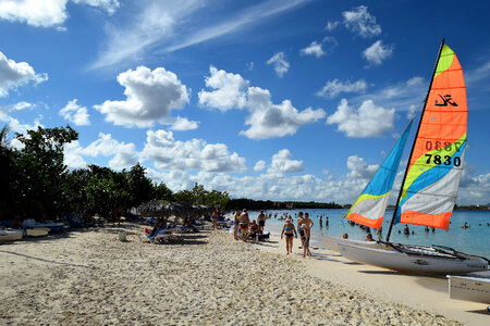 Colorful kayaks and sailing boats on a tropical beach in Cuba