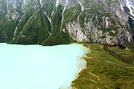 Landscape of Lake Clark against green shoreline