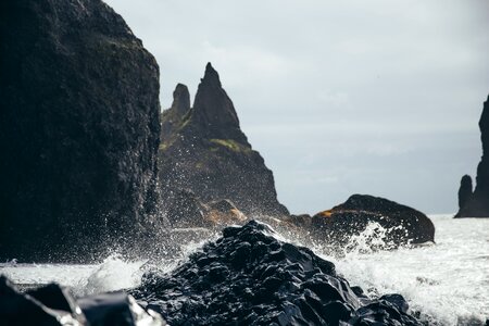 Water Splashing On Black Rock photo