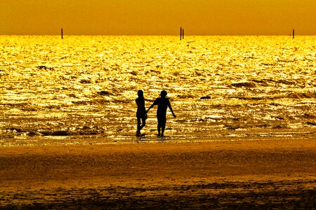 Couple pictures beach hand in hand