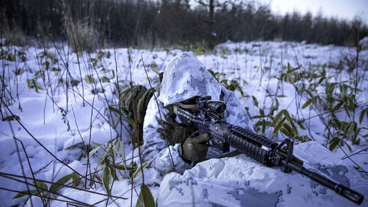 Special forces sniper with large-caliber rifle photo