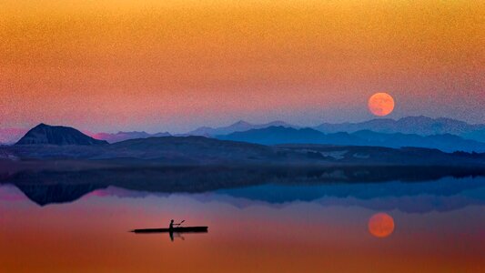 Man Canoe Sunset photo