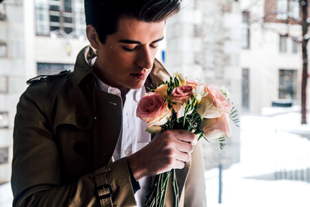 Man Smelling Roses on Valentine's Day photo